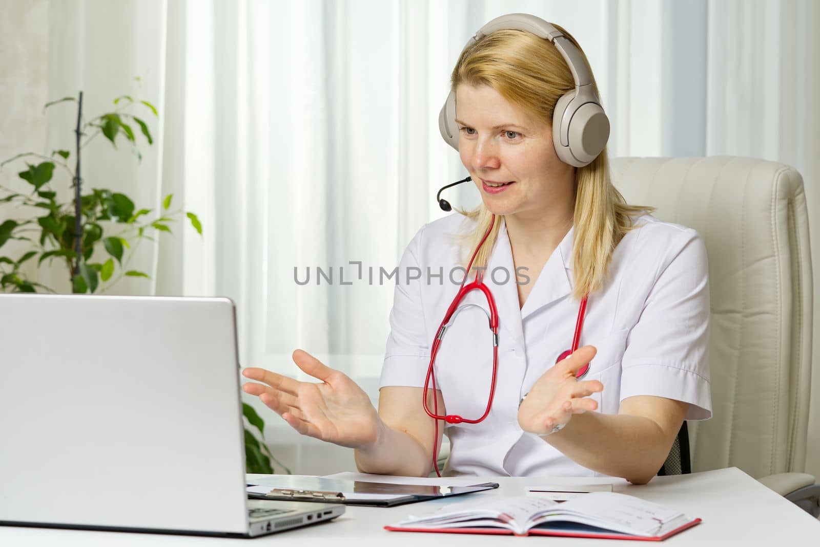 Online consultation doctor Virtual doctor visit telemedicine concept giving advice over laptop by PhotoTime