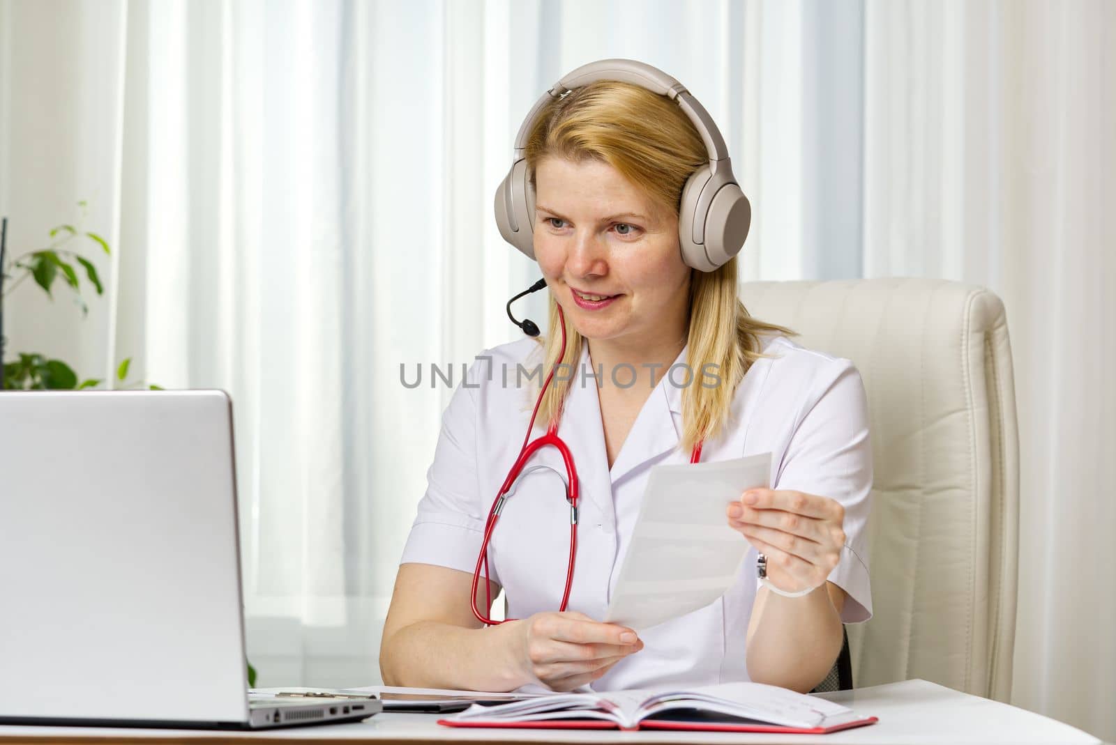 Online consultation doctor Virtual doctor visit telemedicine concept giving advice over laptop by PhotoTime