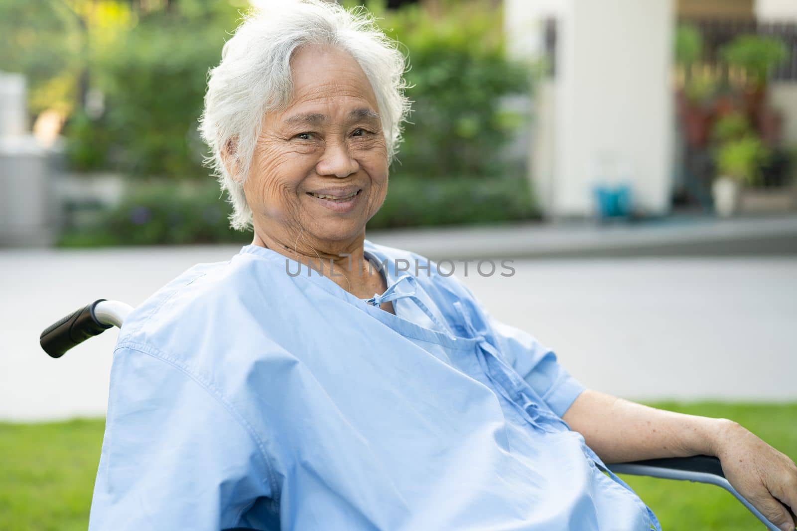 Asian senior or elderly old lady woman patient on wheelchair at nursing hospital ward, healthy strong medical concept.