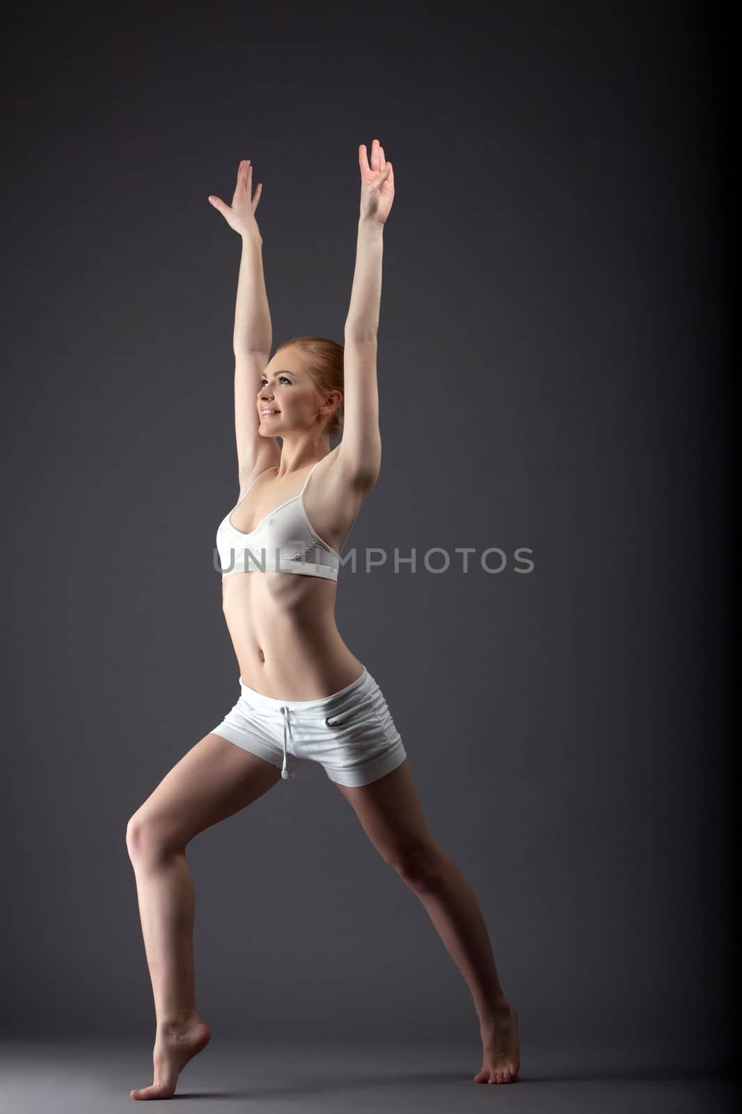 young sexy gymnast girl walk in training cloth look at light