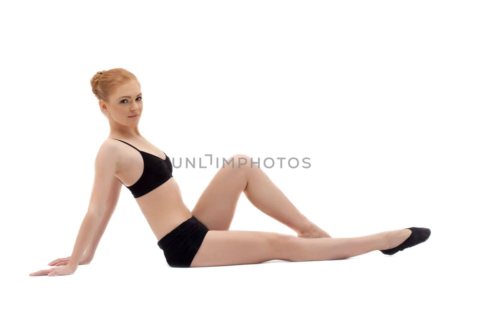 young woman relax in black training suit on white isolated