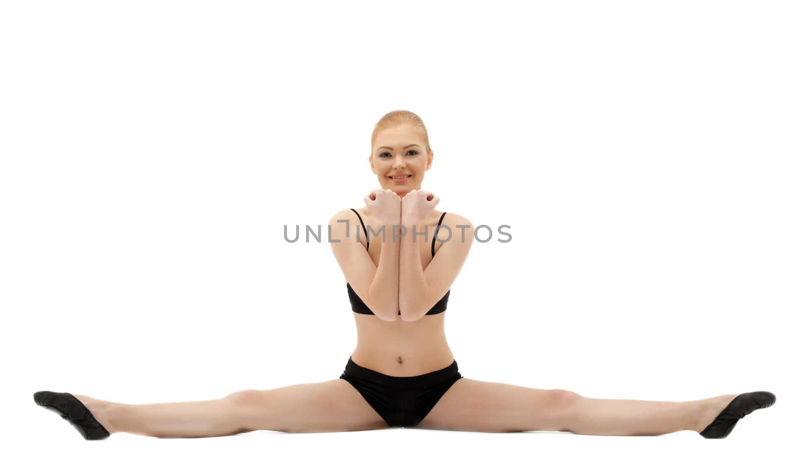 Beauty gymnast smile - doing split isolated on white