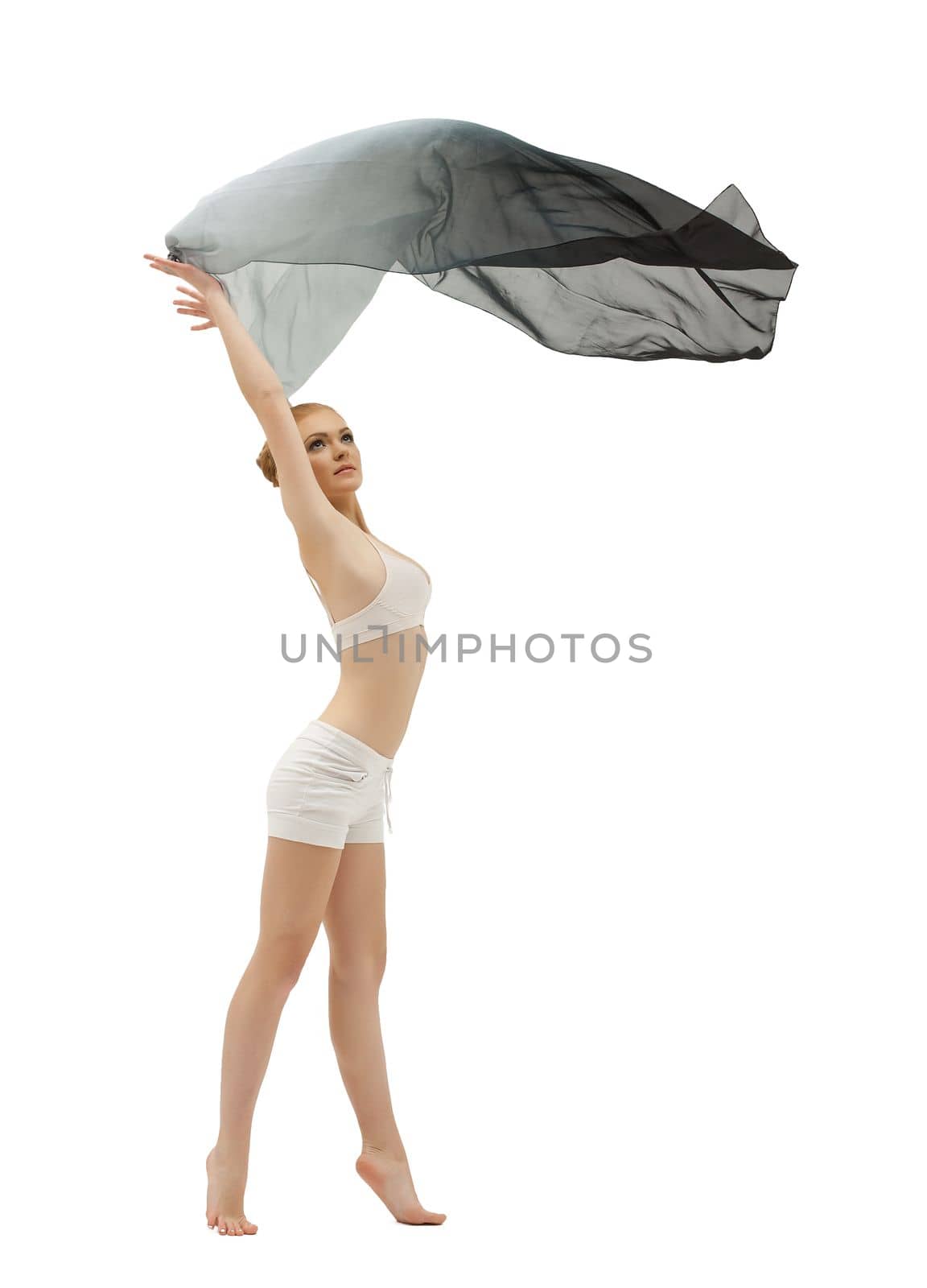 Young girl in dance with flying cloth on white isolated