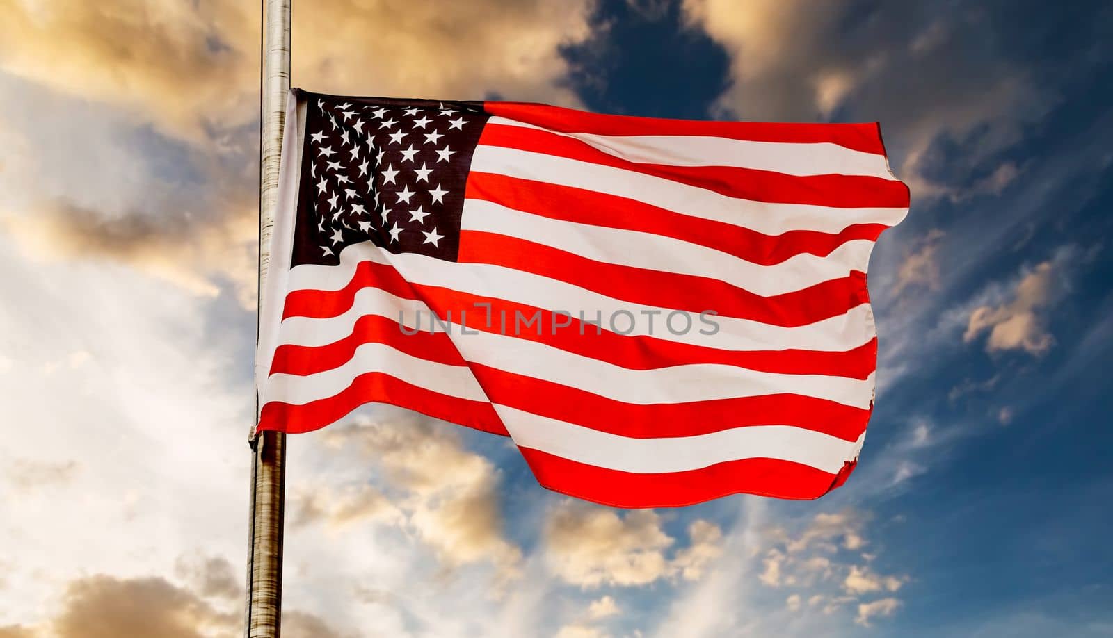 American flag in a sunset sky. USA national flag.