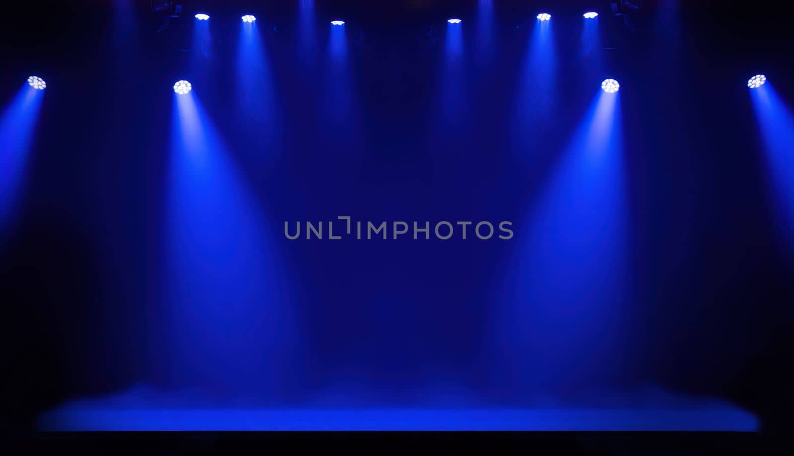 Light on a free stage, scene with blue spotlights on a background
