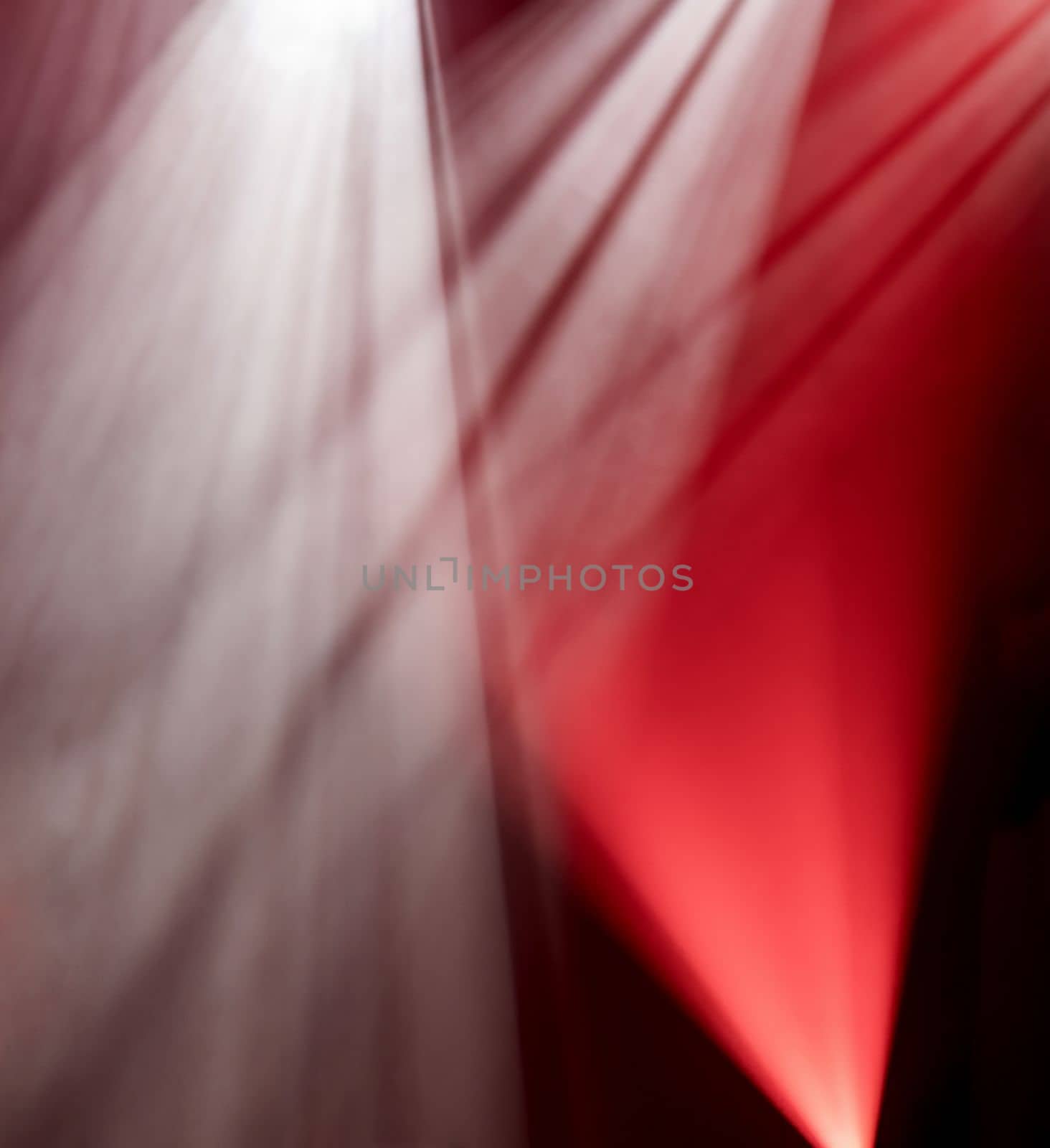 Abstract background of red and white light of stage from spotlights projectors, glow backdrop