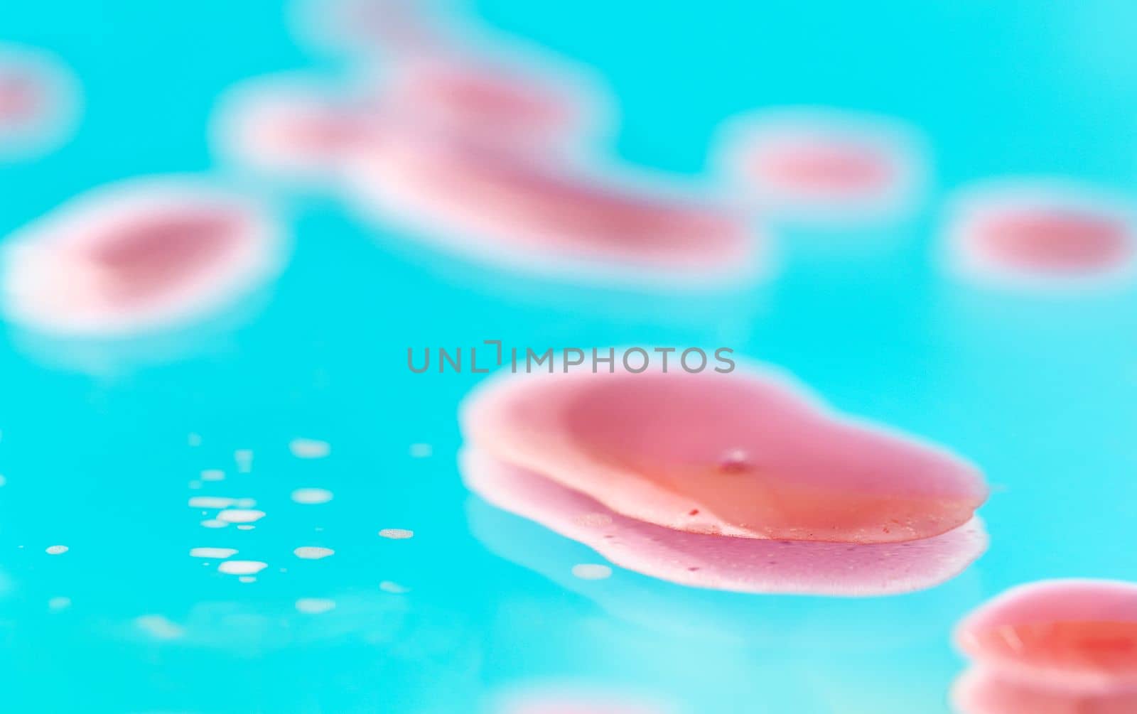 Pink water drops on cyan background  ,full frame , colored abstract background