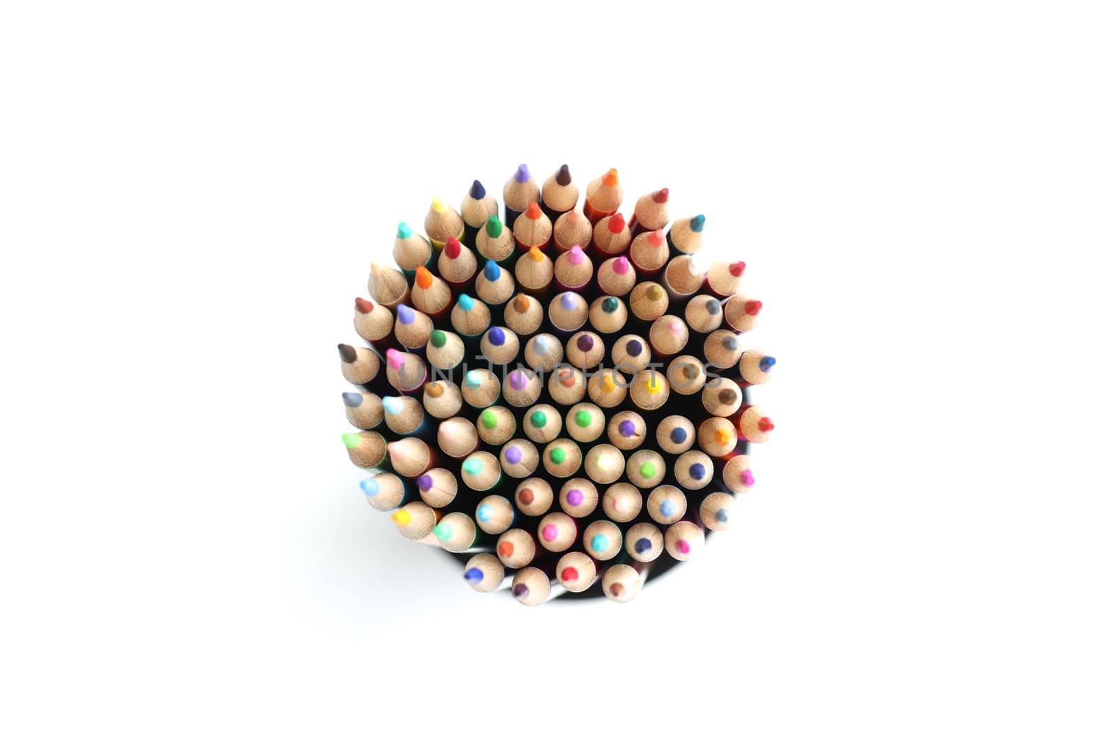Colored pencils circle on white background from above. Colored pencils for drawing concept