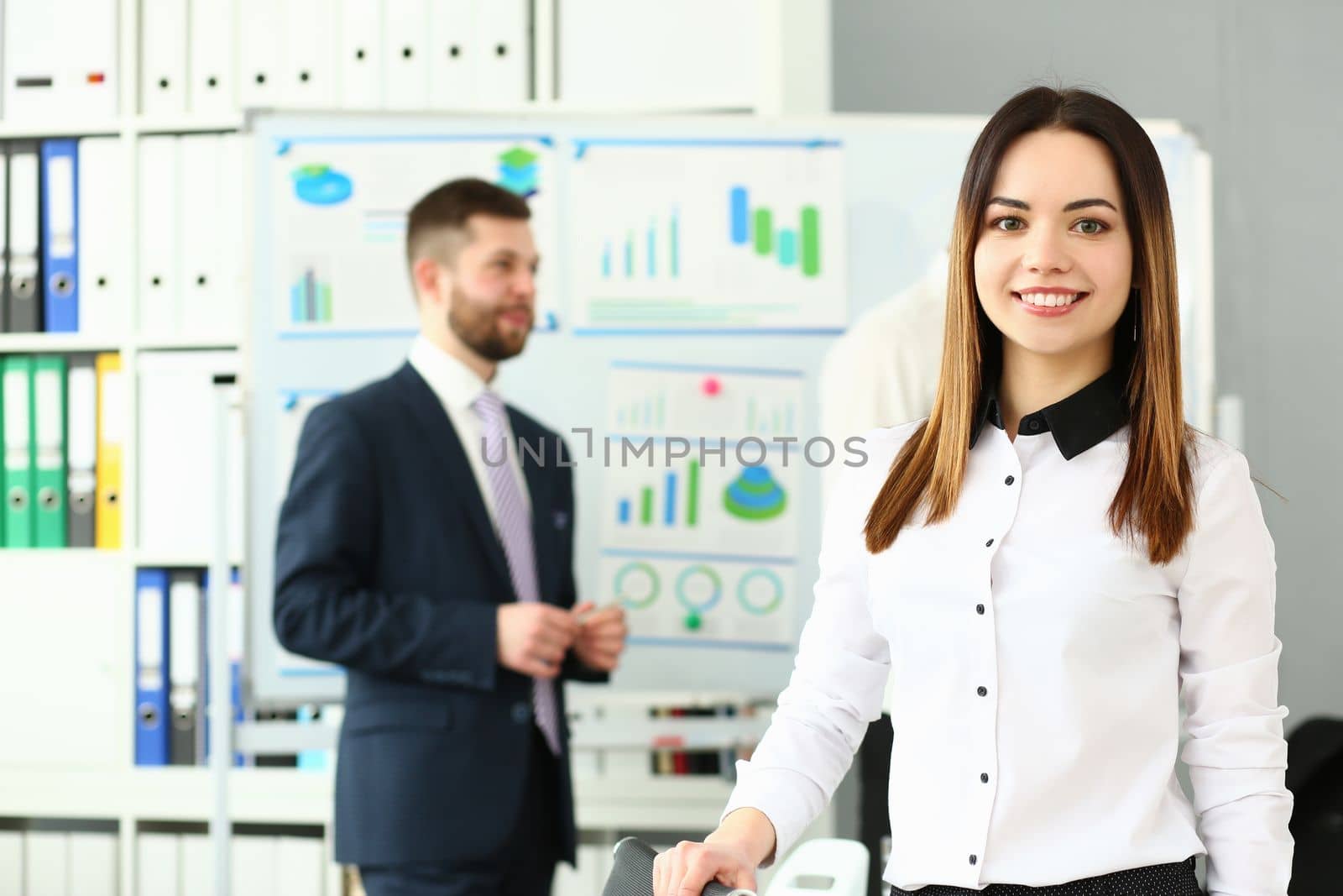 Beautiful smiling woman on training in marketing and analytics by kuprevich