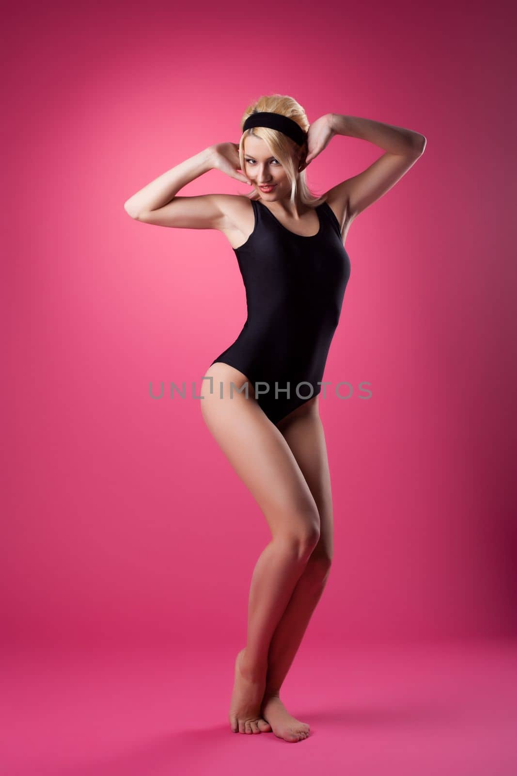 Beauty sexy woman sport pin-up style on pink background