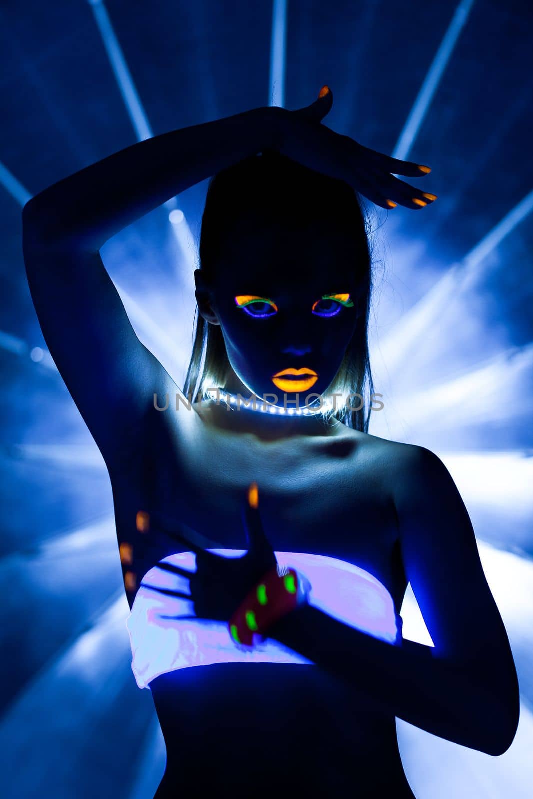 Disco girl with glow make-up dance in uv light by rivertime