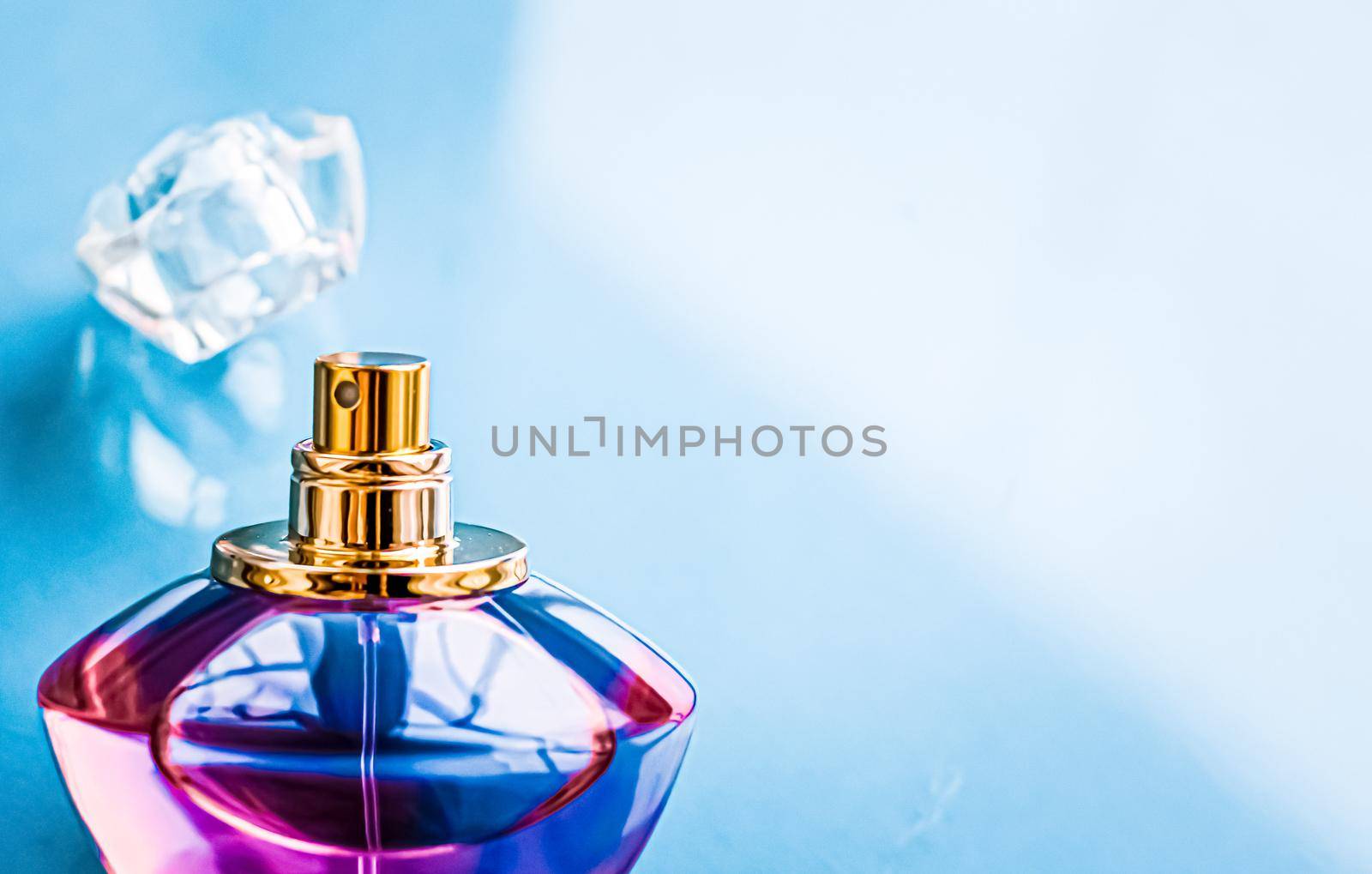 Perfume bottle on glossy background, sweet floral scent, glamour fragrance and eau de parfum as holiday gift and luxury beauty cosmetics brand design.