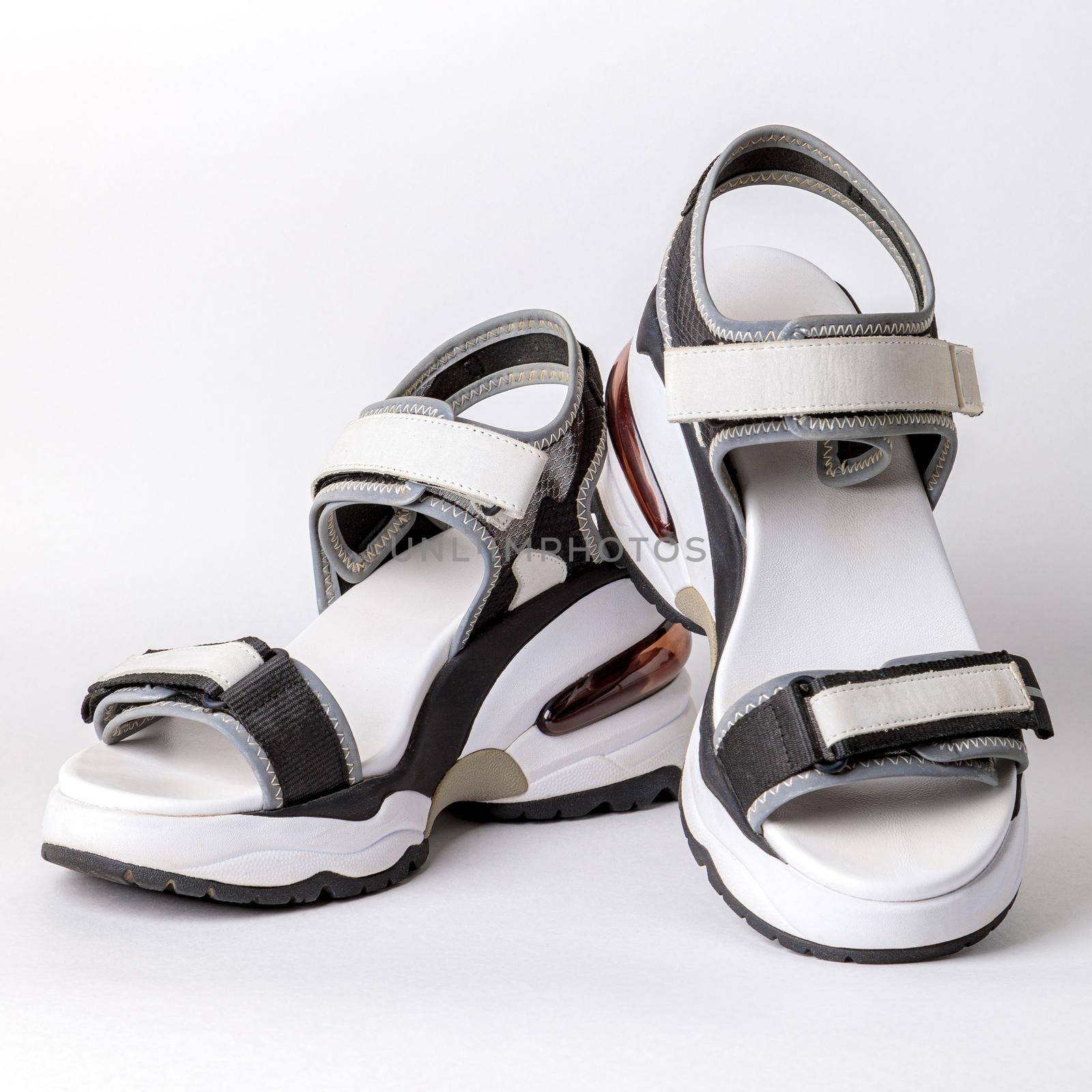 Women's, fashionable, sports sandals on a white background. New youth shoes for girls. Foreground.