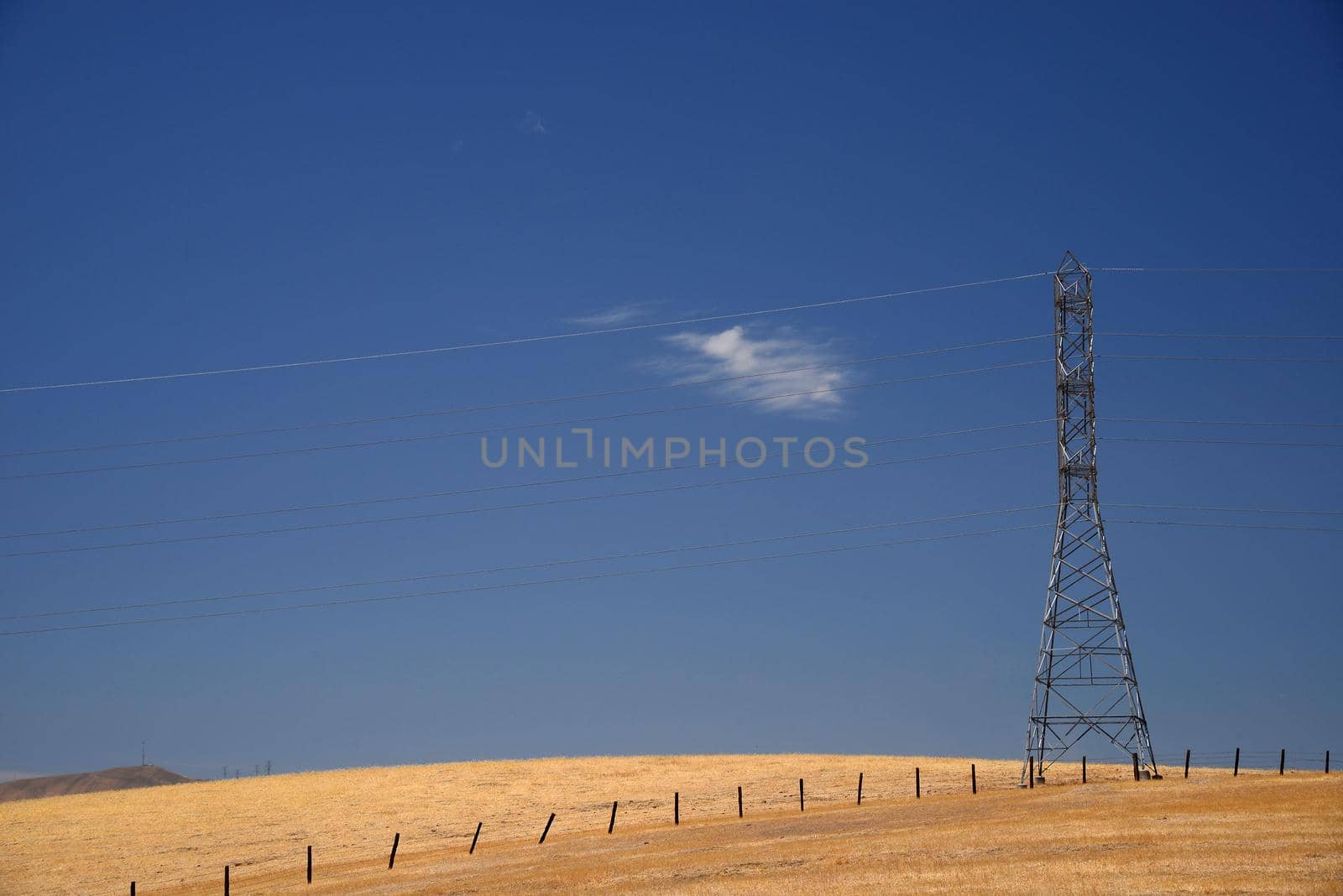 power line on grass hill