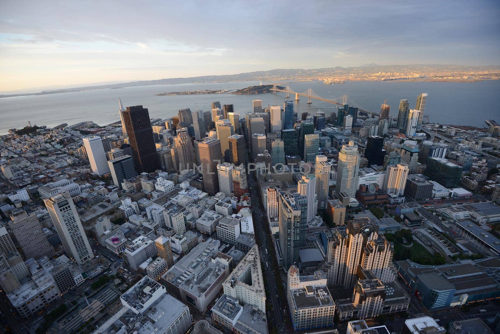 an aerial view of downtown san francisco during sunset