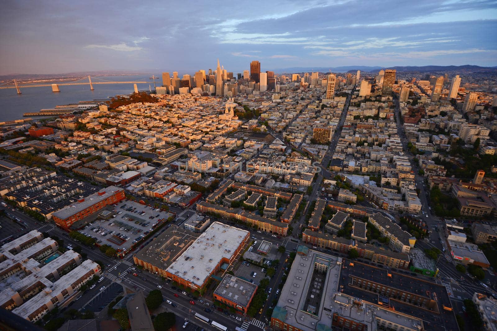 an aerial view of downtown san francisco during sunset