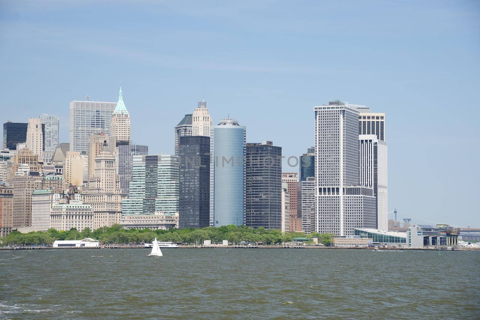 building and skyline of downtown manhattan during daytime as seen from a boat