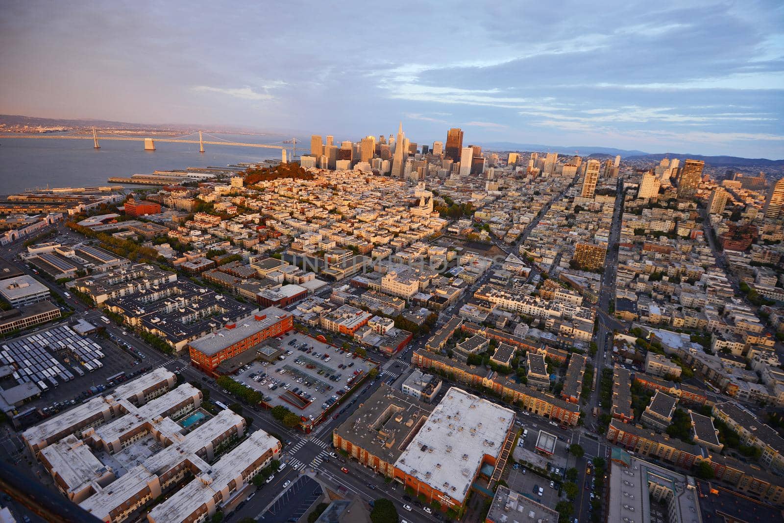 an aerial view of downtown san francisco during sunset