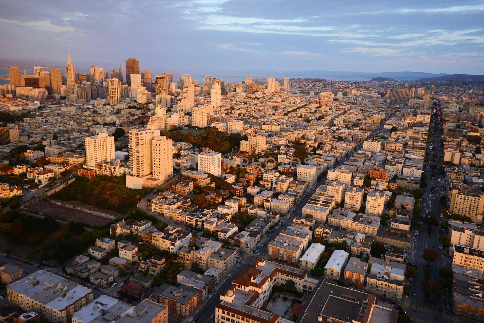 an aerial view of downtown san francisco during sunset