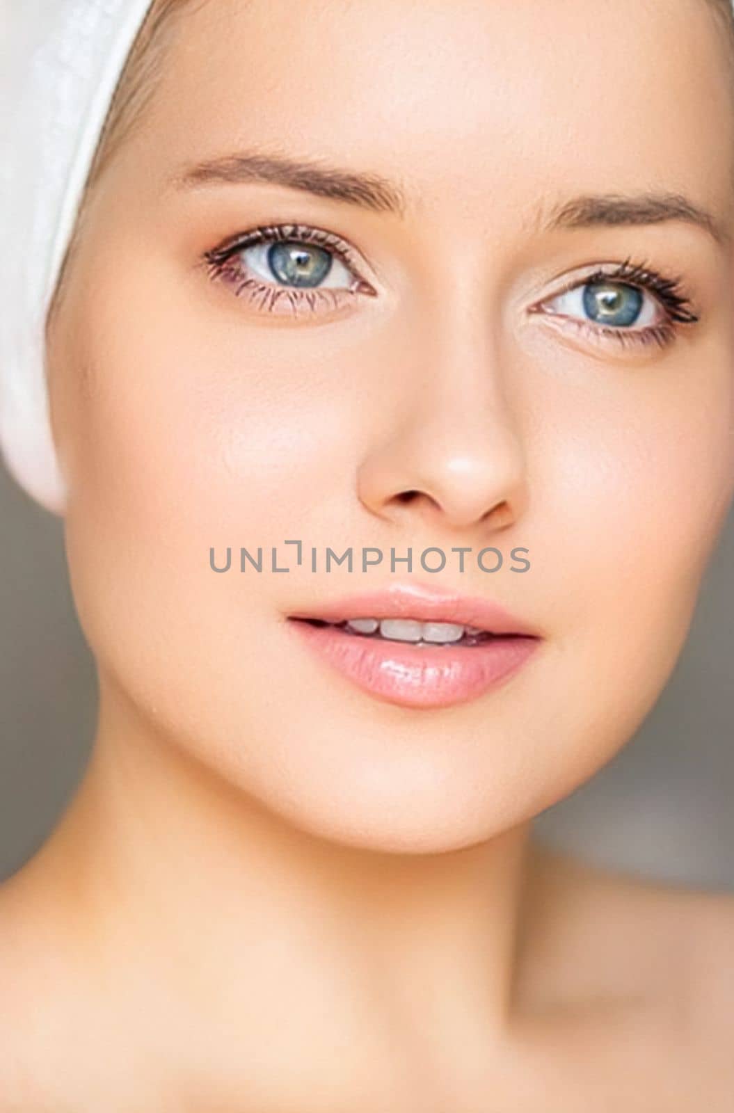 Skin care and beauty routine, beautiful woman with white towel wrapped around head, skincare cosmetics and face cosmetology, close-up portrait