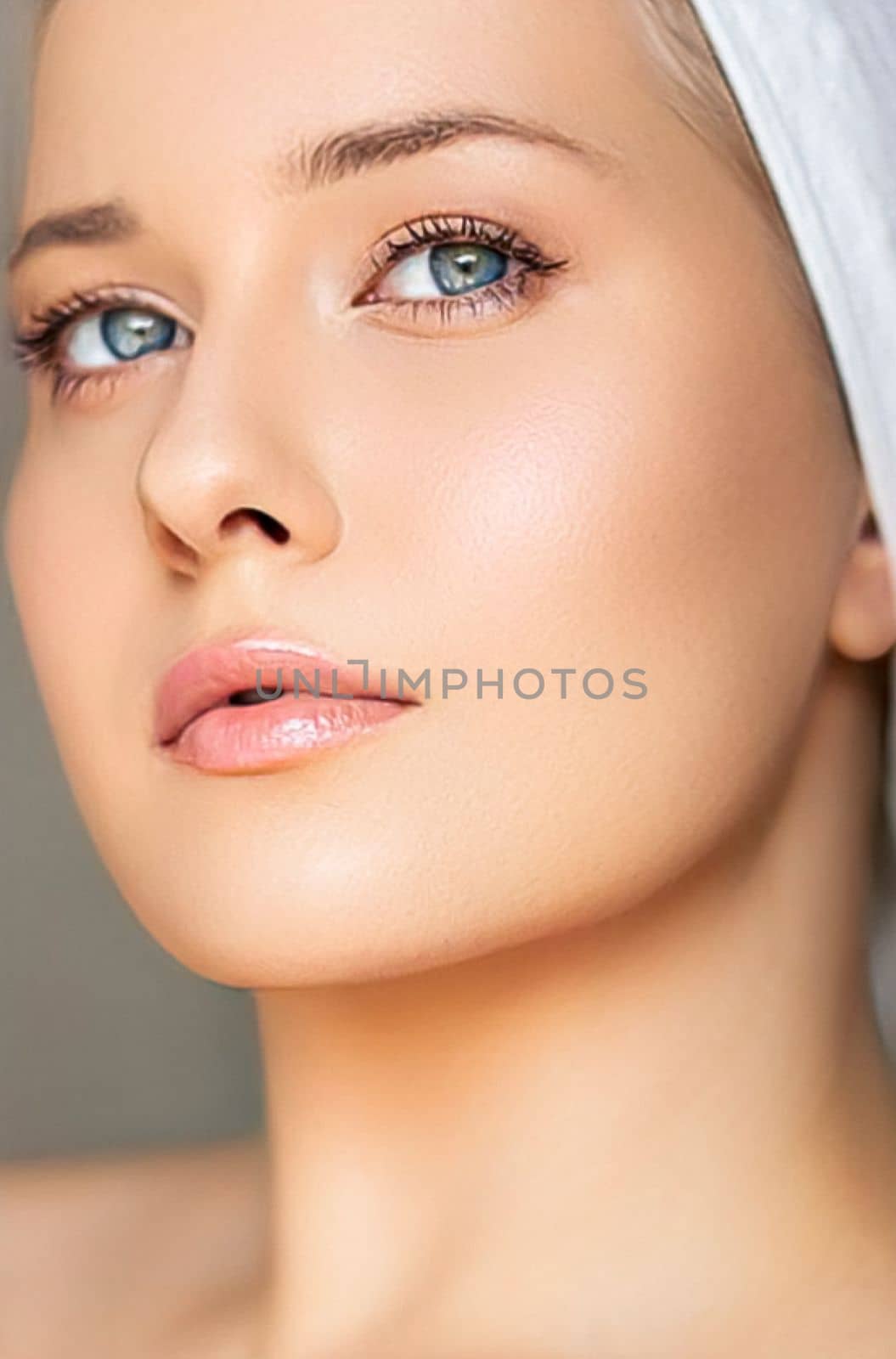 Skin care and beauty routine, beautiful woman with white towel wrapped around head, skincare cosmetics and face cosmetology, close-up portrait