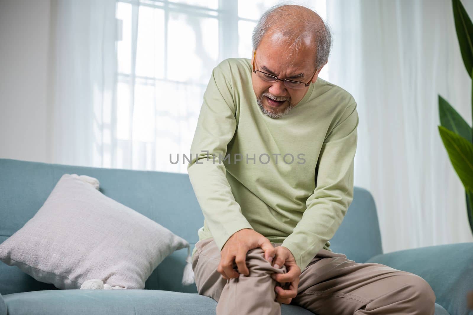 Senior man having painful knee pain after ligament surgery by Sorapop