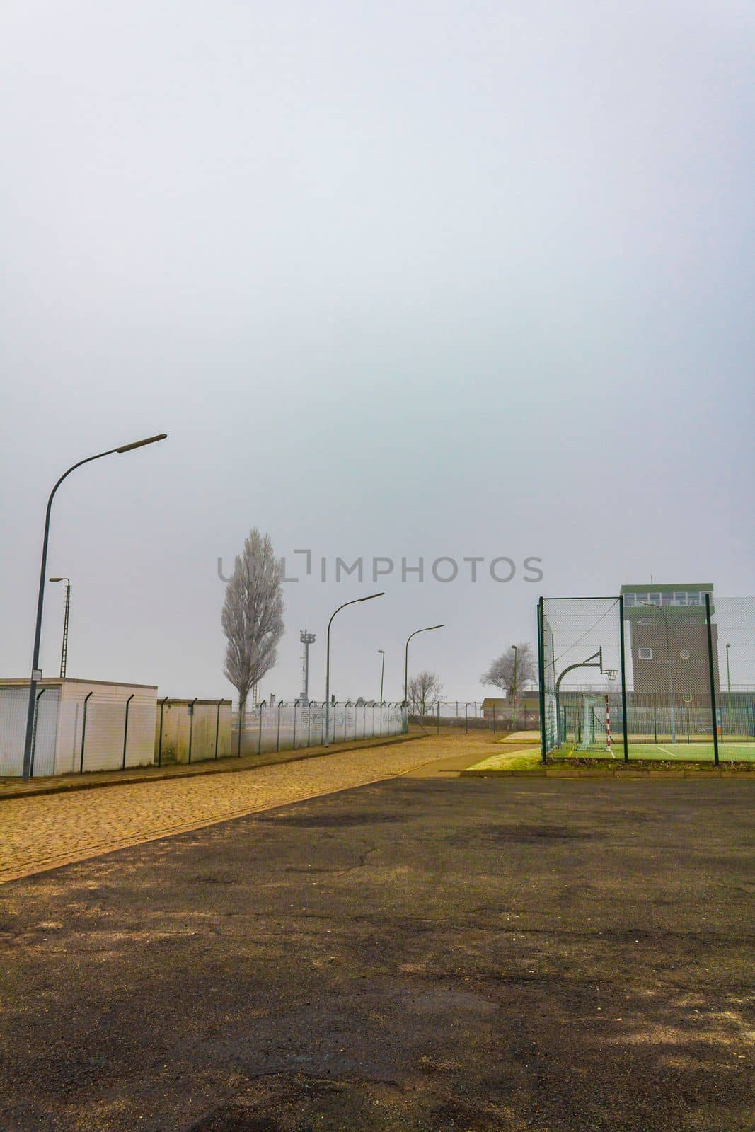 Gloomy cold winter landscape with frost and fog in Center of Bremerhaven Bremen Germany.