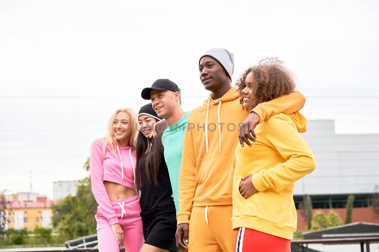 Multi-ethnic group people teenage friends. African-american, asian, caucasian student spending time together Multiracial friendship by andreonegin
