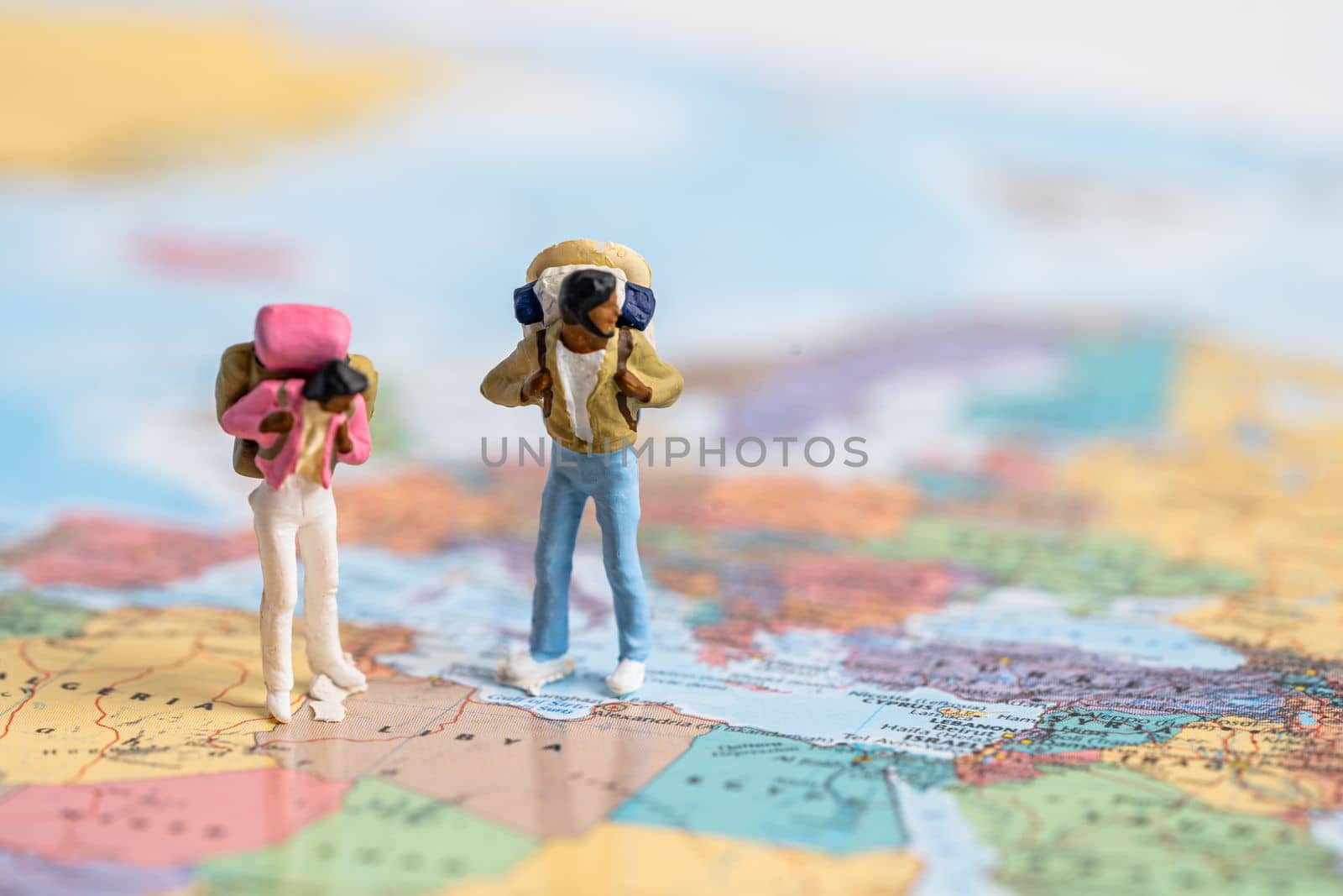 Bangkok, Thailand, July 30, 2022 Miniature people,Backpacker enjoy to discovery journey travel at amazing on world map.