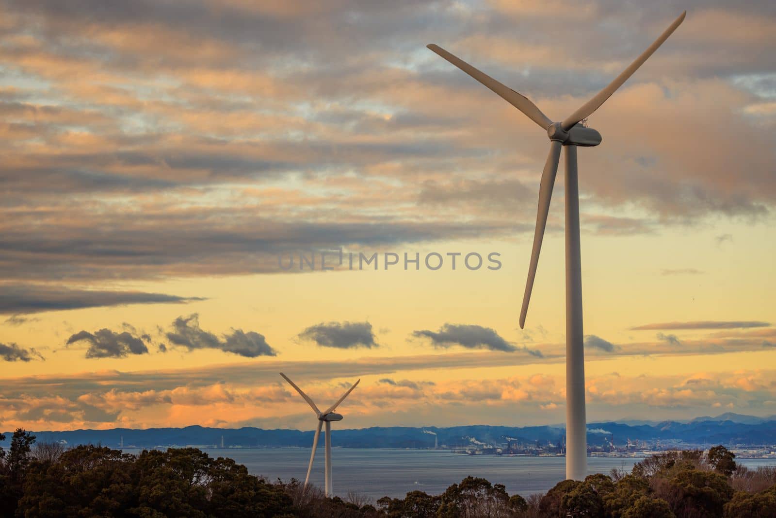 Wind turbines on Awaji Island windfarm at sunset. High quality photo