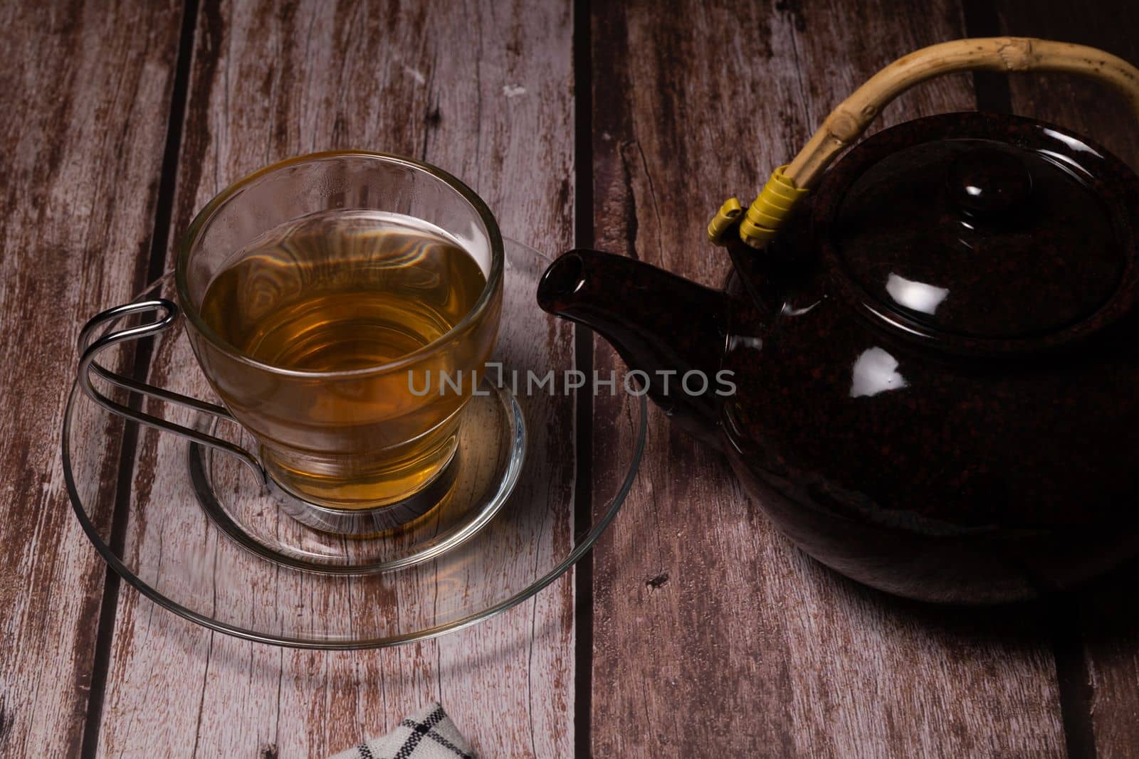 teacup and teapot pouring hot tea by joseantona