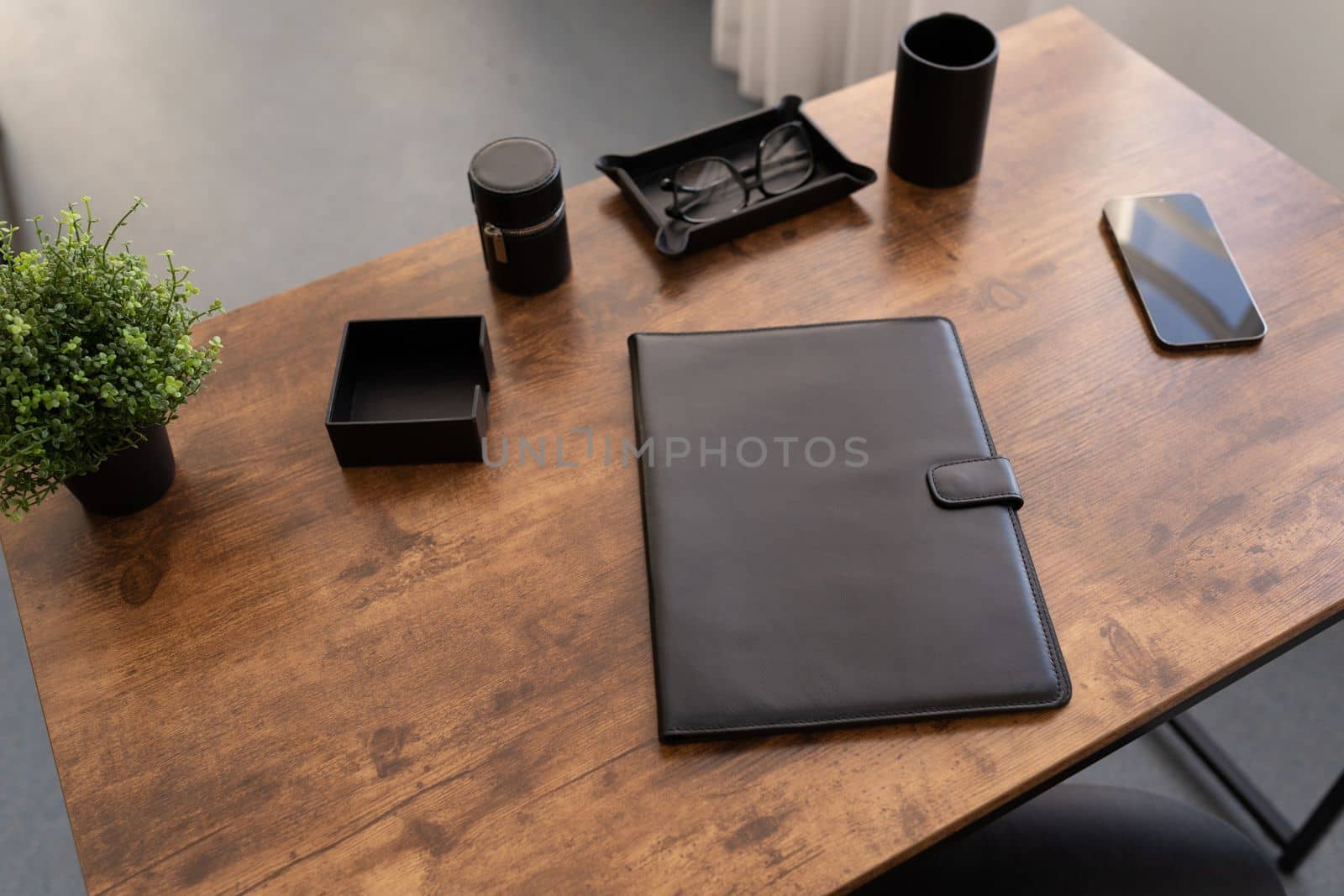 leather folder for documents on the desktop in the office by TRMK