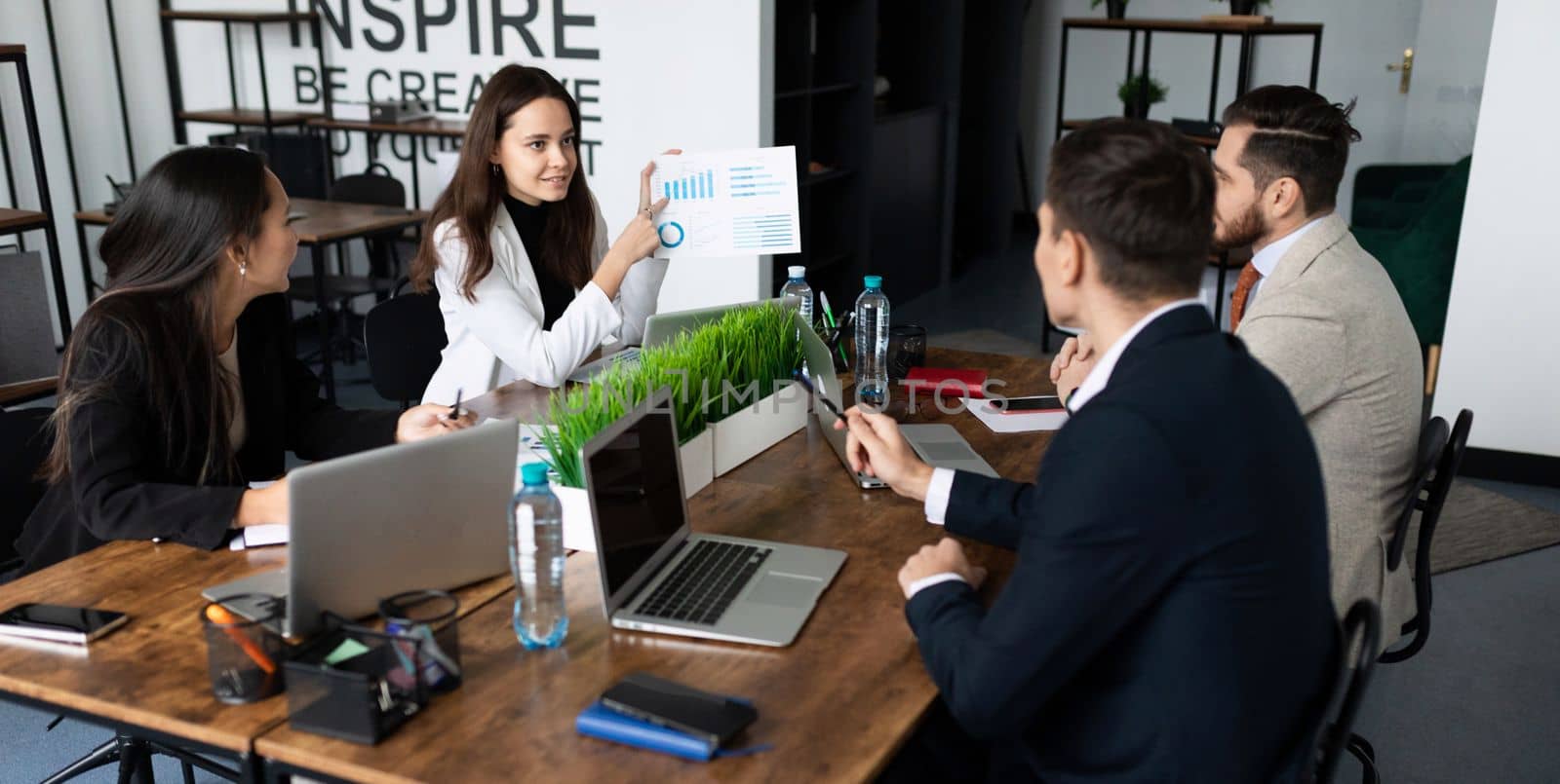 meeting of colleagues of business partners at a large desktop.