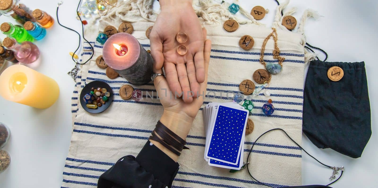 A woman fortuneteller tells a man on tarot cards. Selective focus. People.