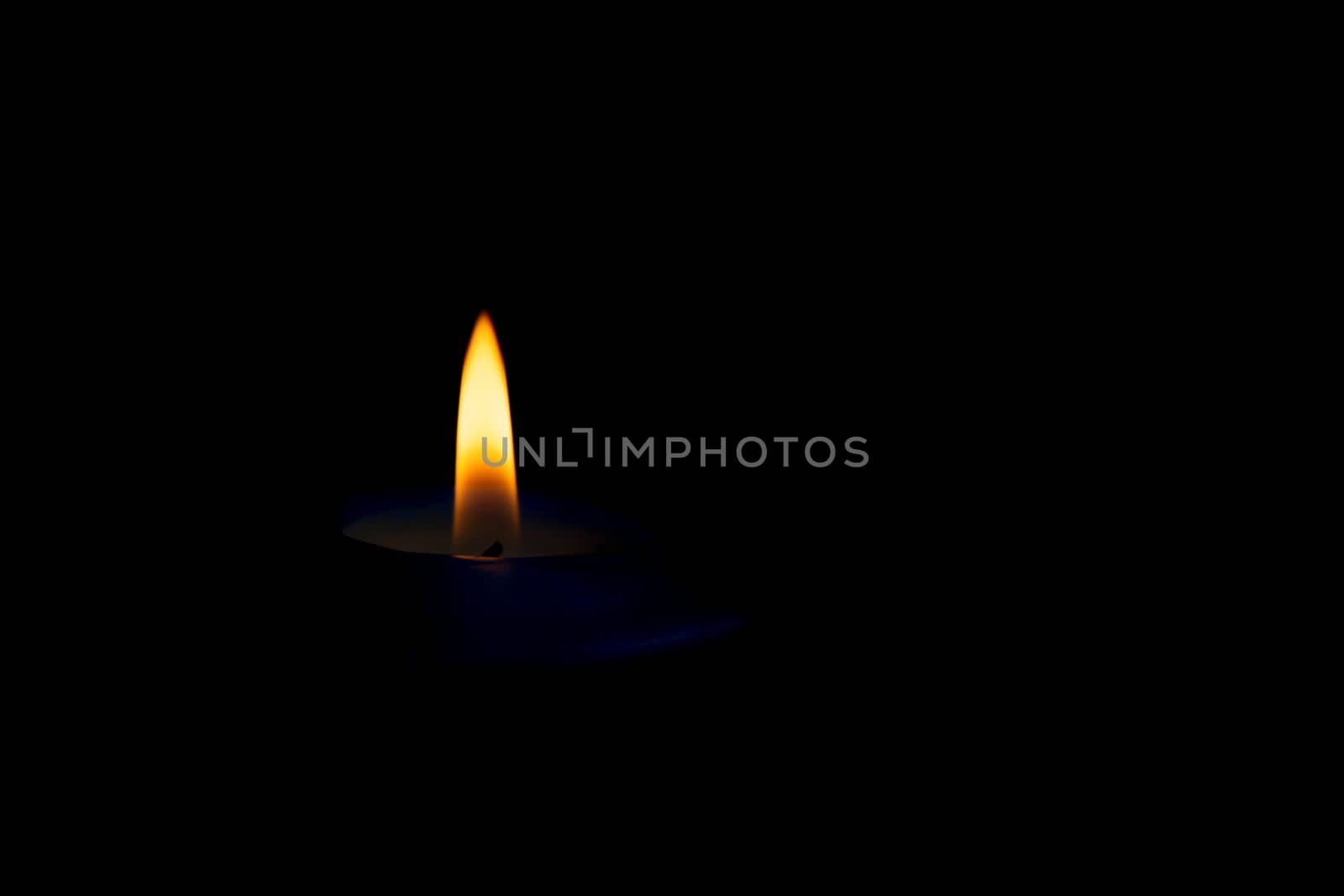blue candle flame on black background