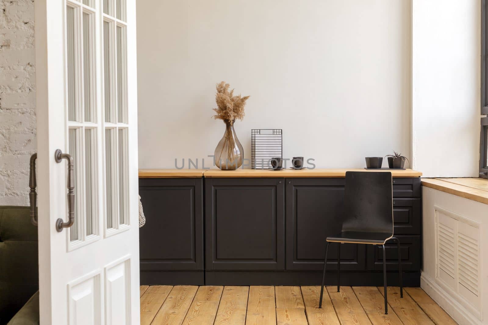 Interior of modern minimal kitchen in apartment by Demkat