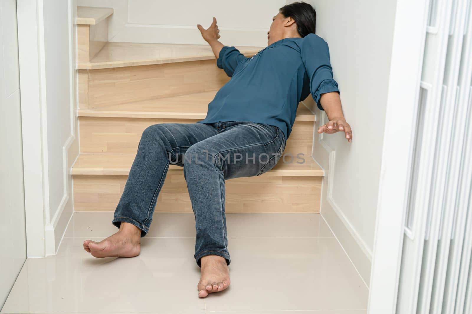 Asian lady woman patient fall down the stairs because slippery surfaces