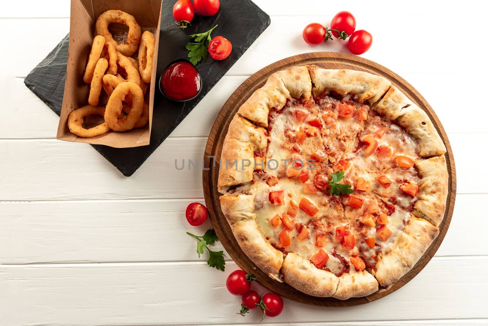 Set of pizza and snacks on a white background. Margarita pizza and snacks onion rings fried in breading by gulyaevstudio