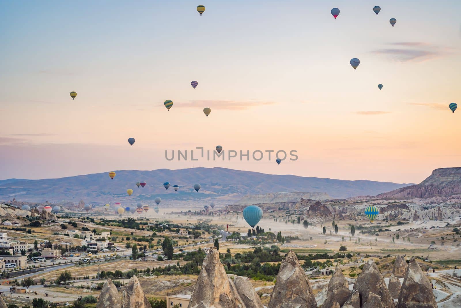 Colorful hot air balloon flying over Cappadocia, Turkey.