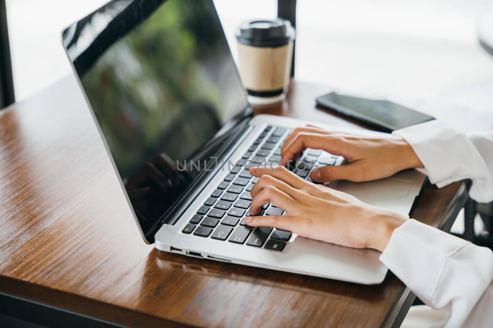 Happy beautiful freelancer blogger typing keyboard on laptop for writing blog web page by Sorapop