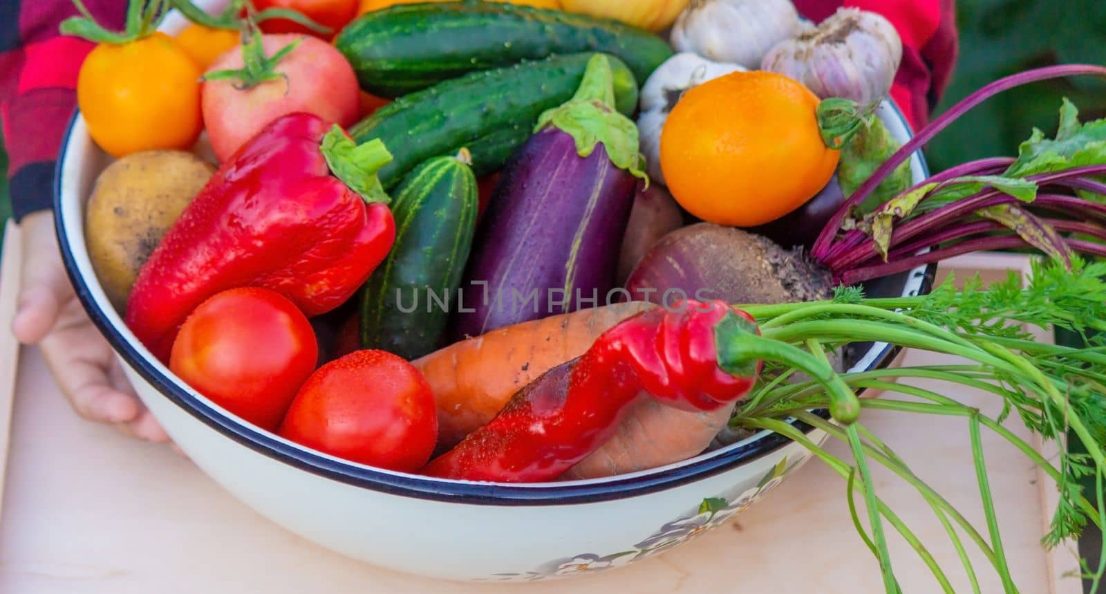 Child and vegetables. Selective focus feram