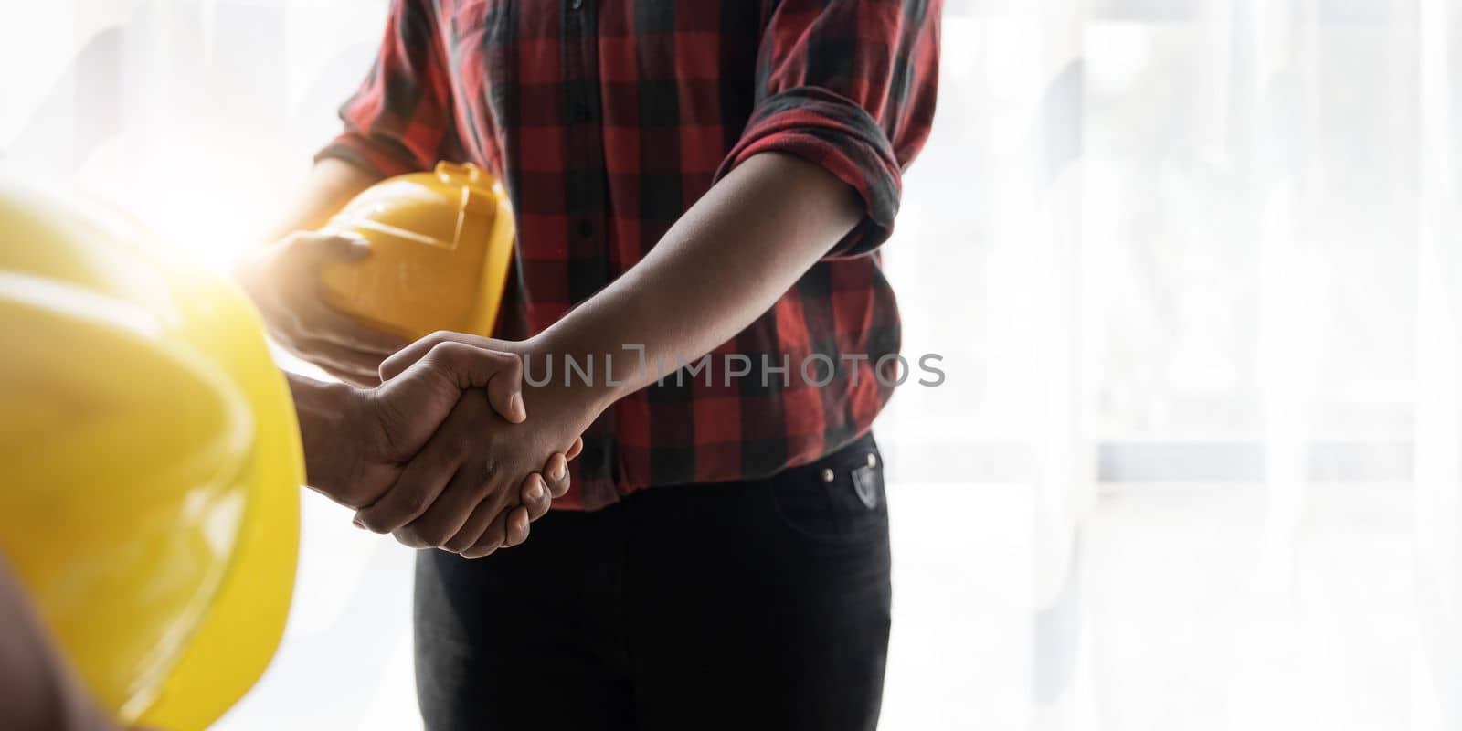 Hand in hand between project contractors and customers due to negotiation of expenses and investments, construction and repair of residential buildings.. by wichayada