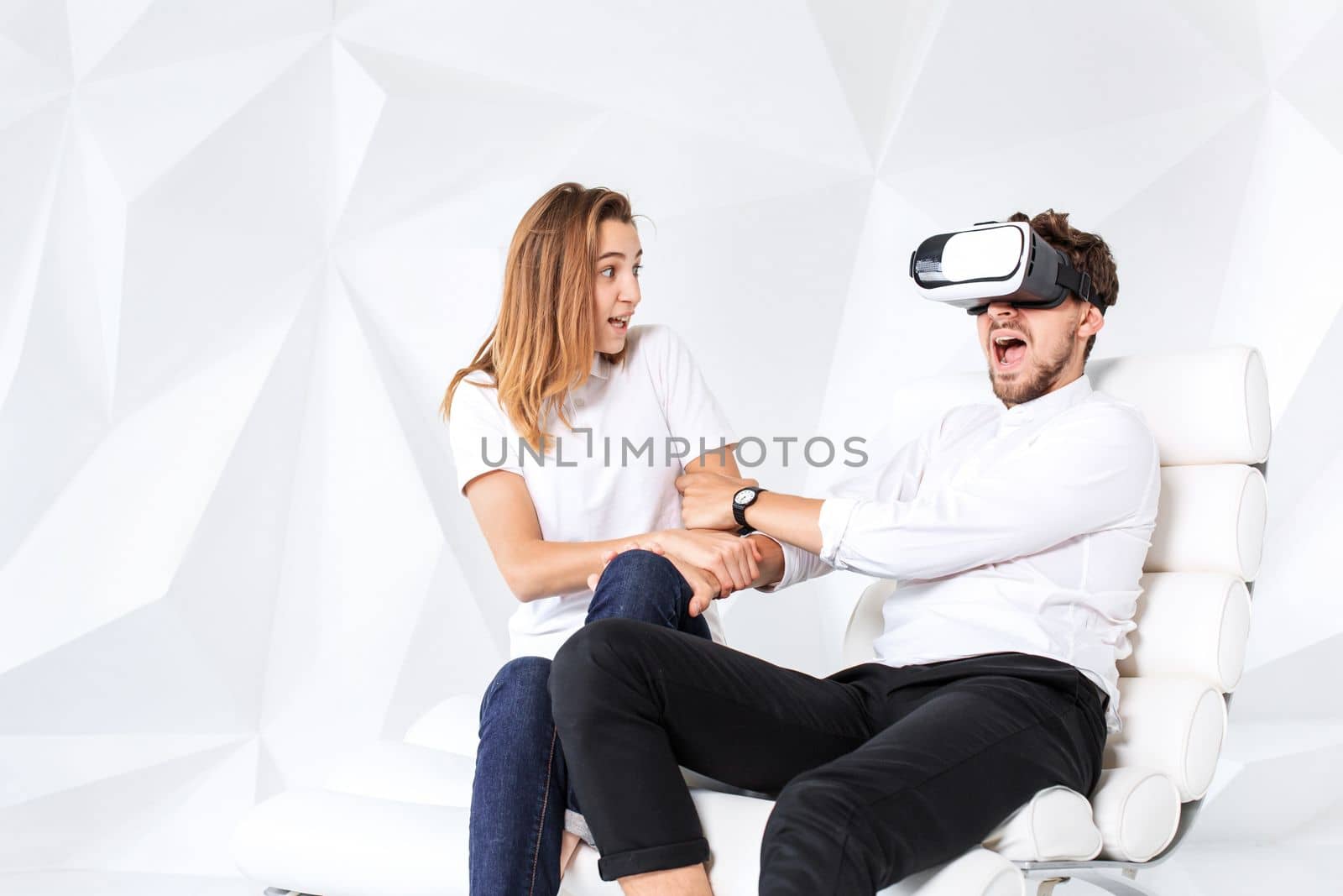 Couple having fun playing with virtual reality by nazarovsergey