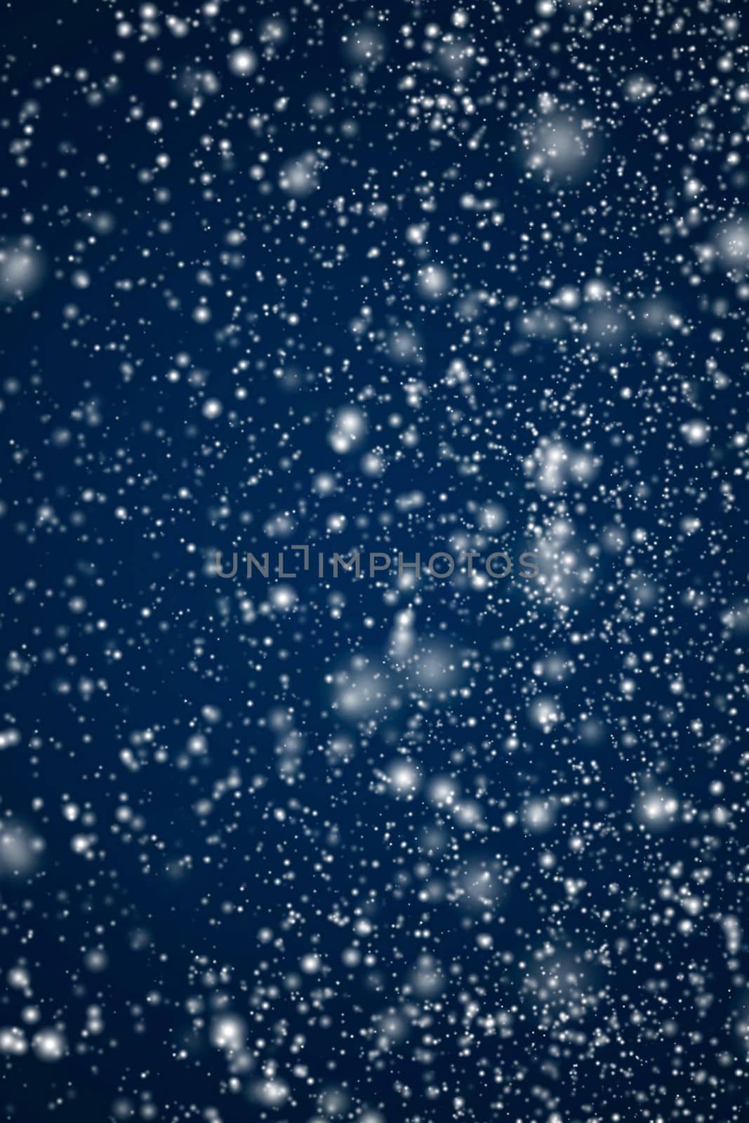 Winter holidays and wintertime background, white snow falling on dark blue backdrop, snowflakes bokeh and snowfall particles as abstract snowing scene for Christmas and snowy holiday design by Anneleven