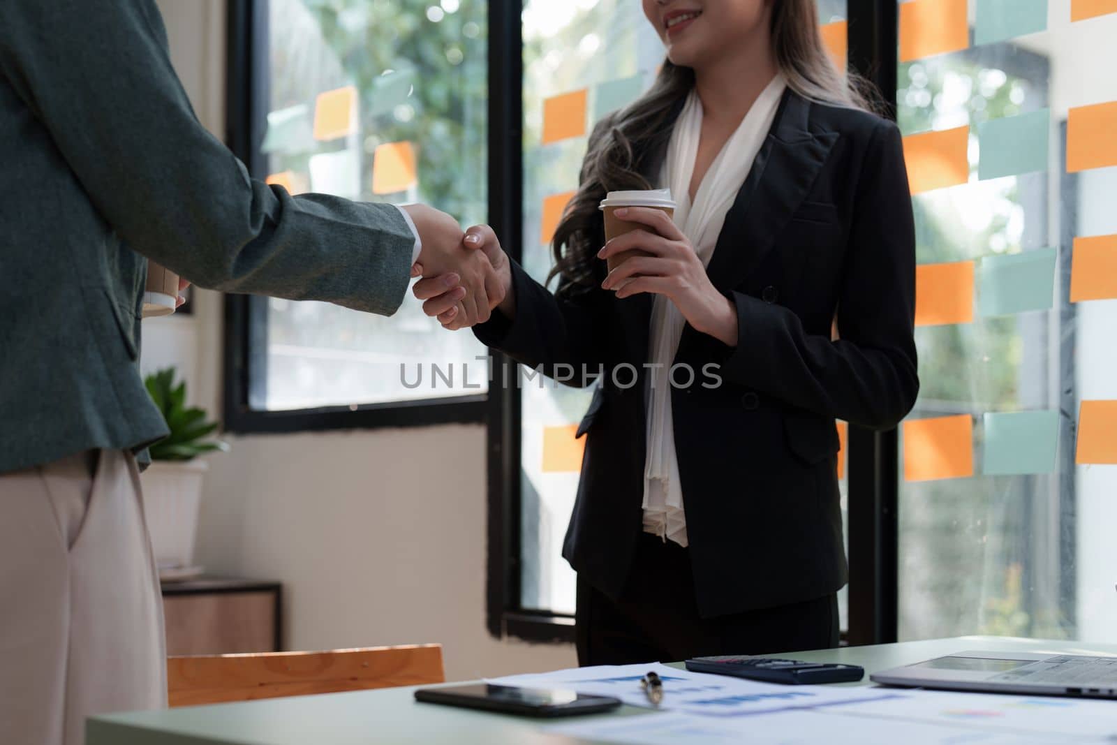 Business partnership meeting concept. Image businessmans handshake. Successful businessmen handshaking after good deal. Group support concept by itchaznong