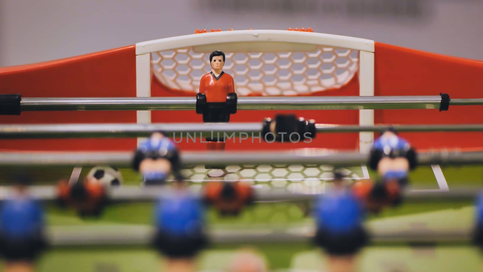 Players play table football in the clubhouse