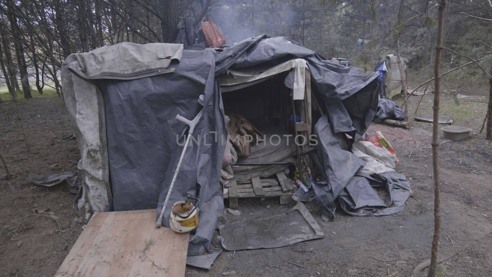 Homemade homeless dwelling next to a landfill