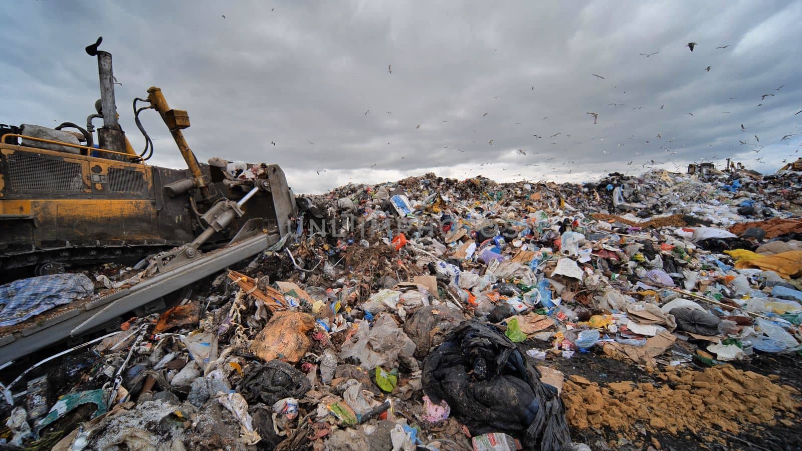 Work of a bulldozer at a landfill