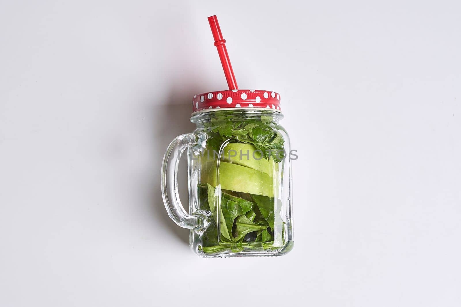 a glass mason jar filled with pickle juice by golibtolibov