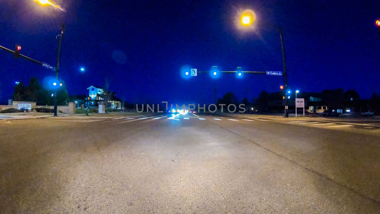 Denver, Colorado, USA-January 17, 2020 - Driving on typical paved roads at night in suburban America.